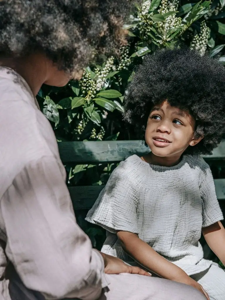a mother and a toddler boy having a conversation