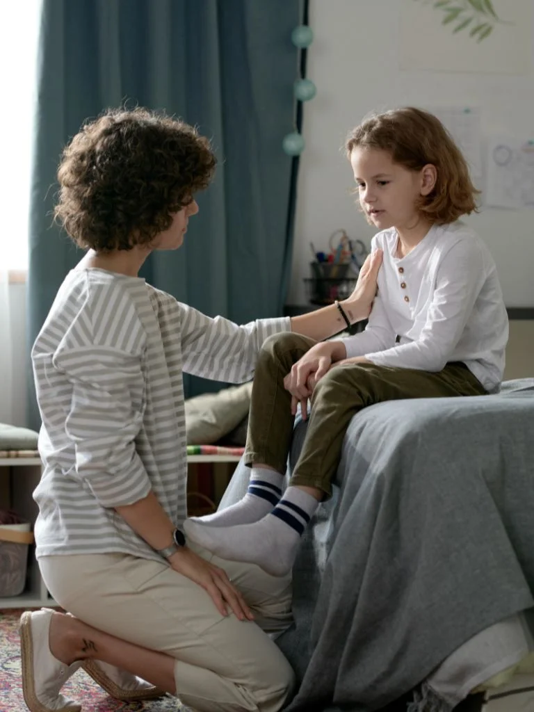 a mother and toddler having a conversation