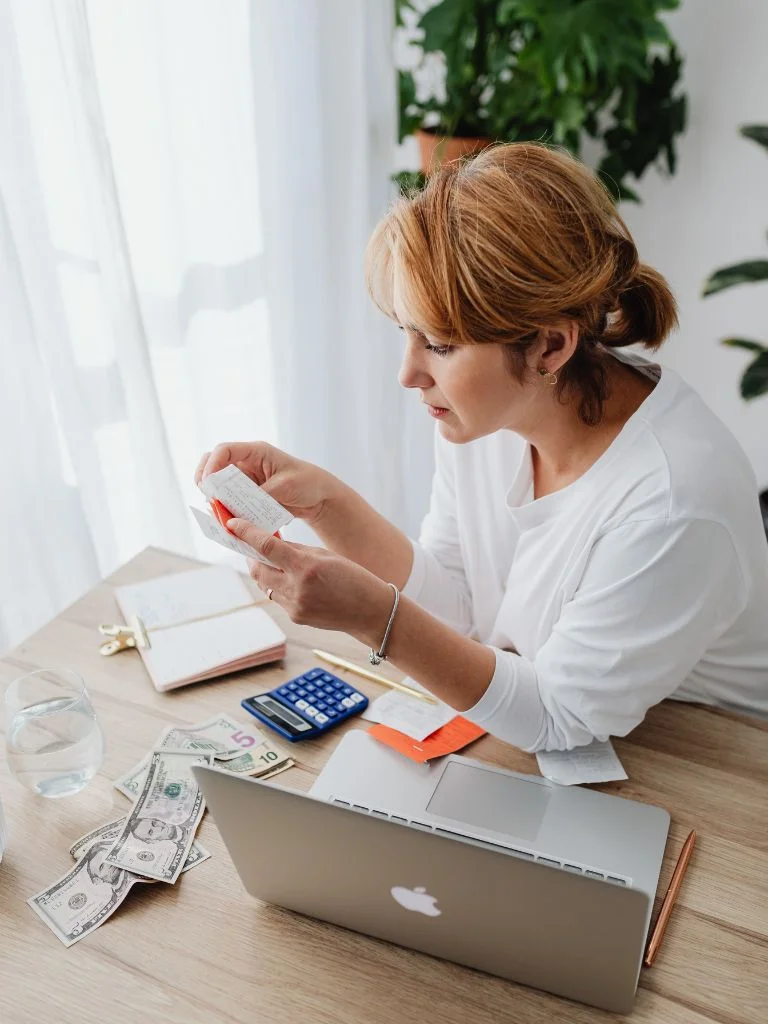 a shot of a woman managing her expenses