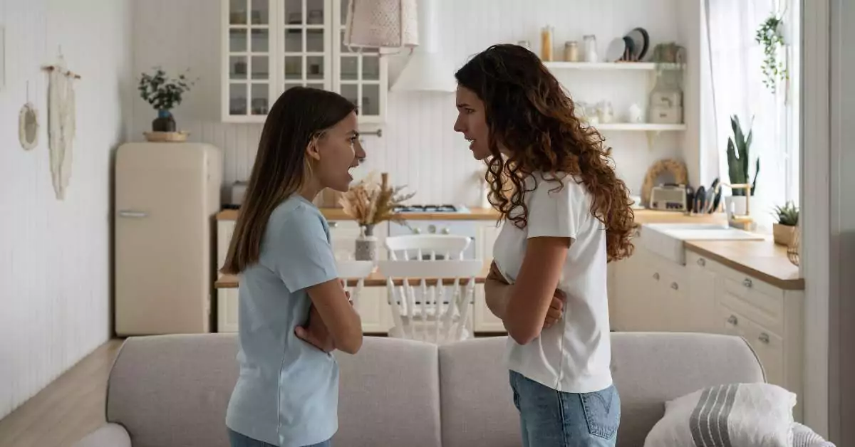 This image features a mother talking to her teenage daughter.