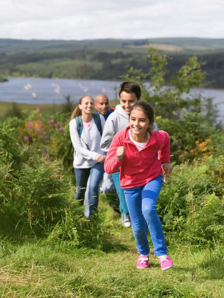 a family of for trailing in mountains