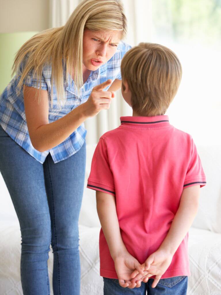 a mom disciplining her son