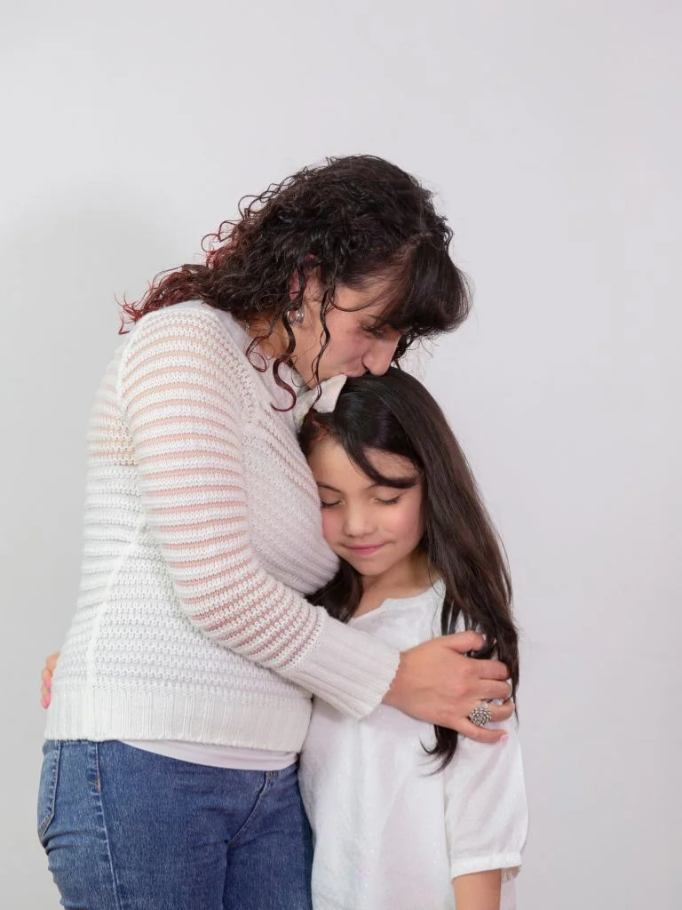 picture of a mom and daughter hugging