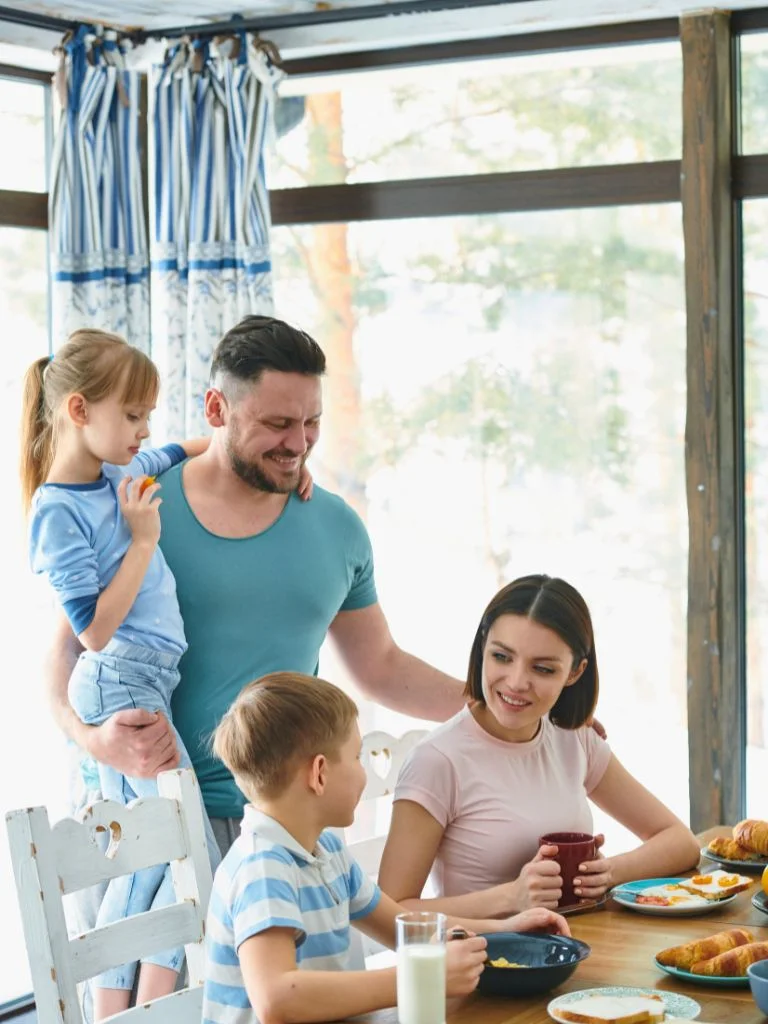 a shot of a happy family having breakfast together